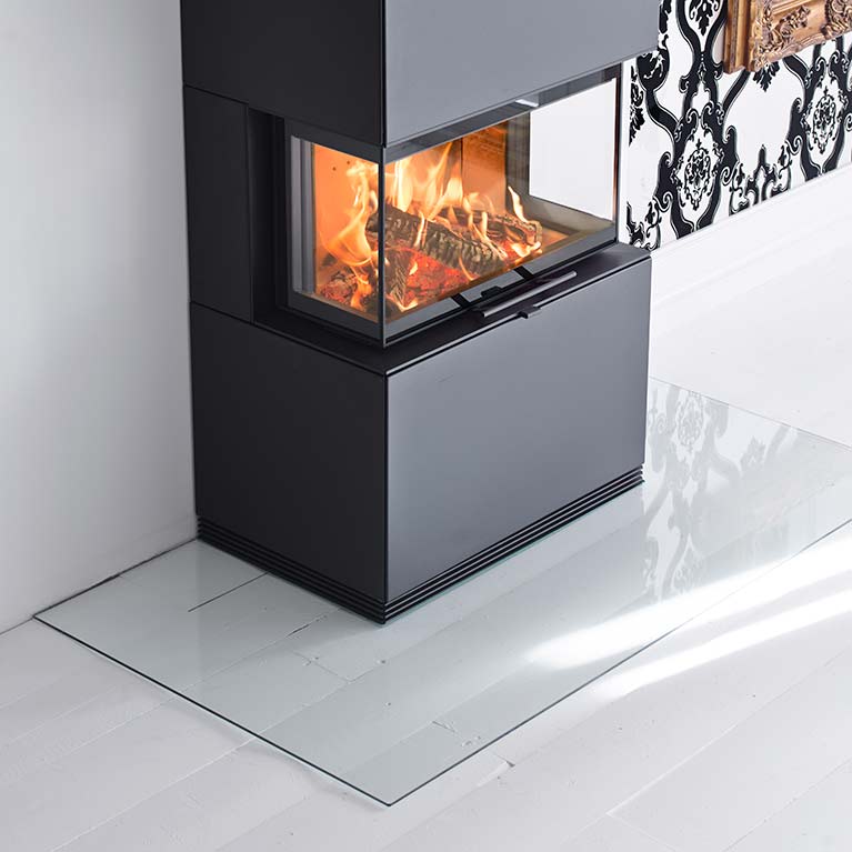 Angled floor protector for wood burning stoves