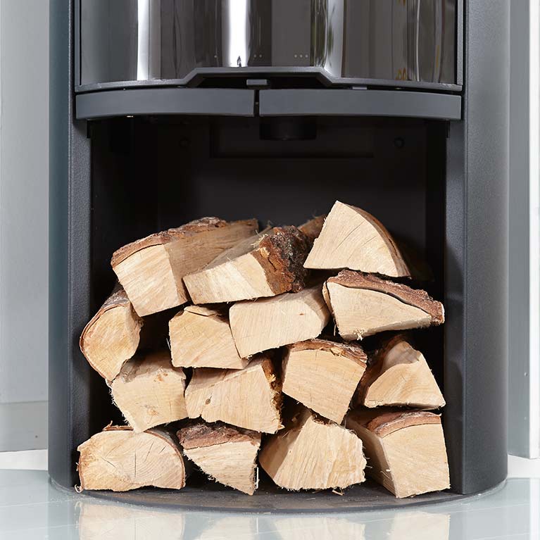 A practical log compartment under the stove