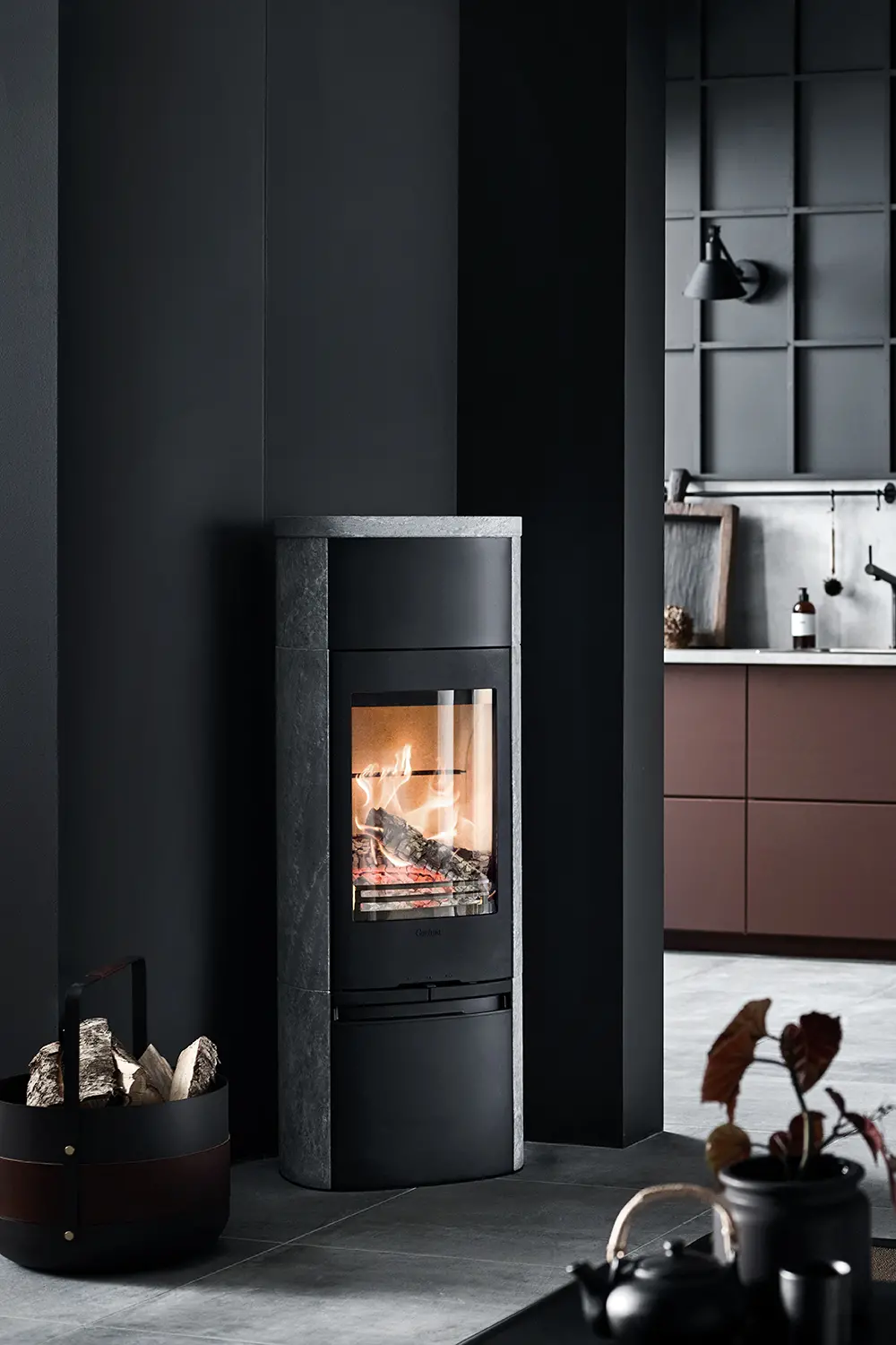 Contura 890T Style, installed in a darker style kitchen/home.